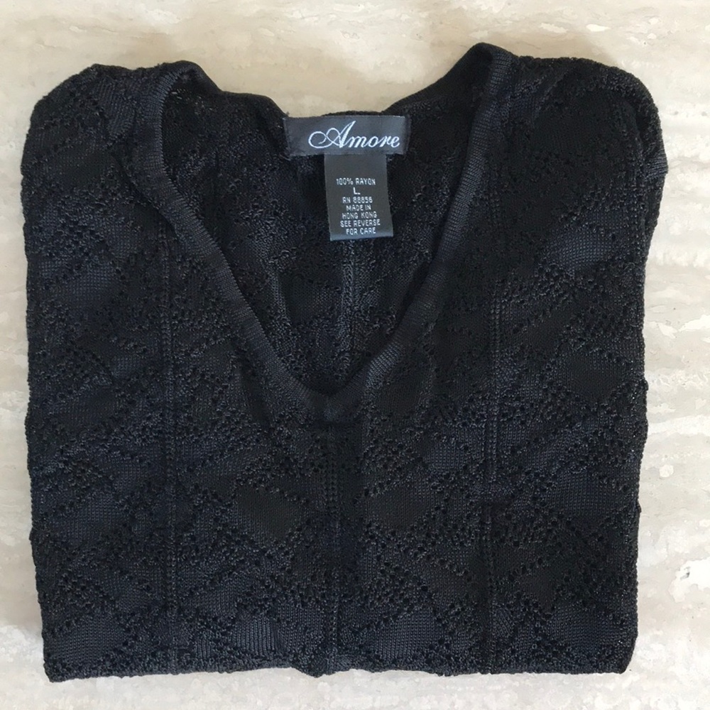 black fitted sweater.
